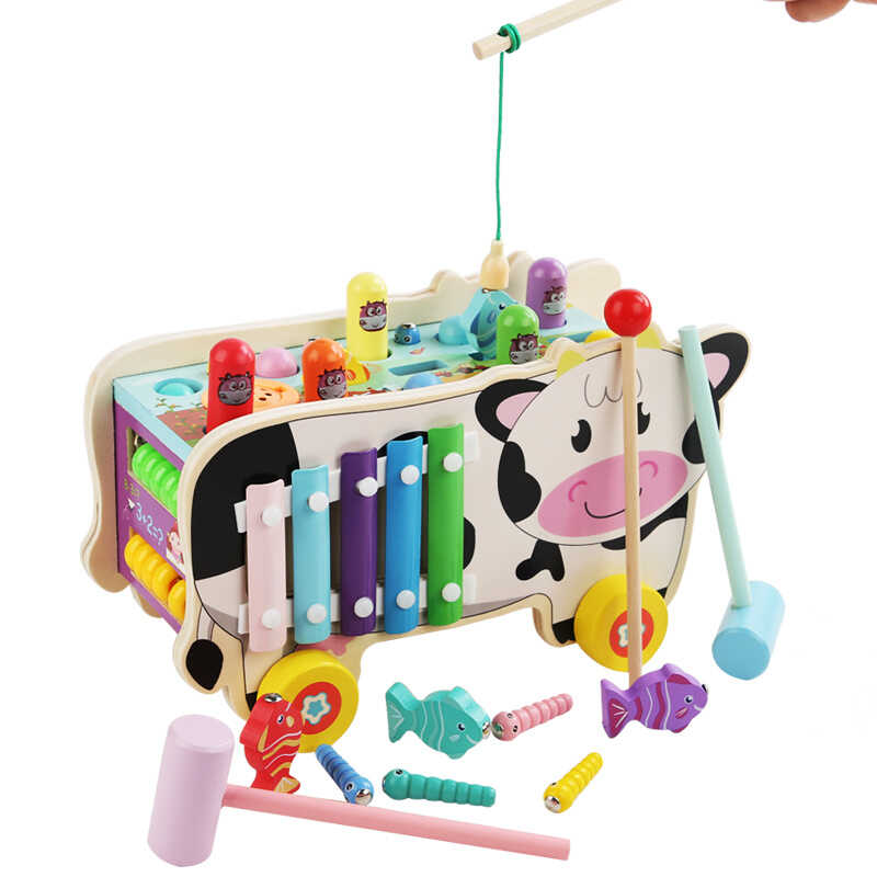 Ігровий центр C 74300 (18) “Корівка”, дерев’яний, каталка, ксилофон, стукалка, магнітна риболовля, рахівниця, пальчиковий лабіринт, молоточки, в коробці